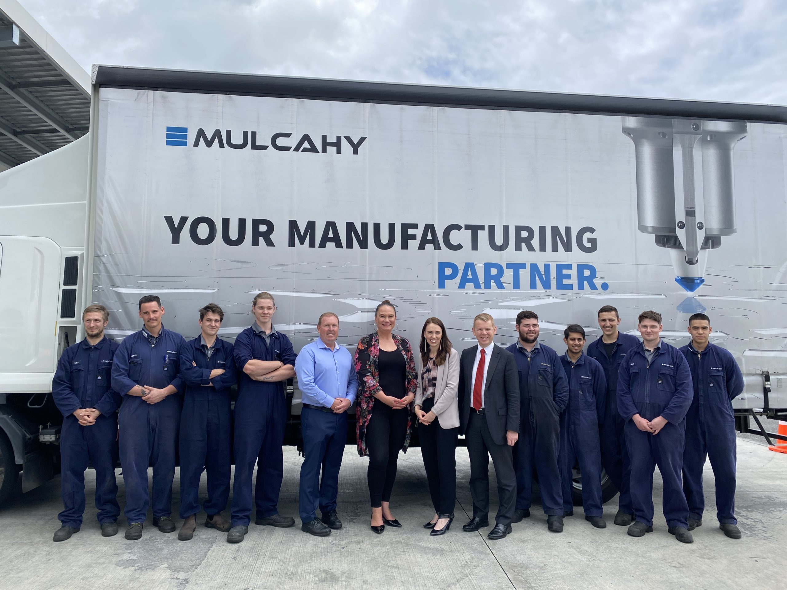 Group shot beside truck